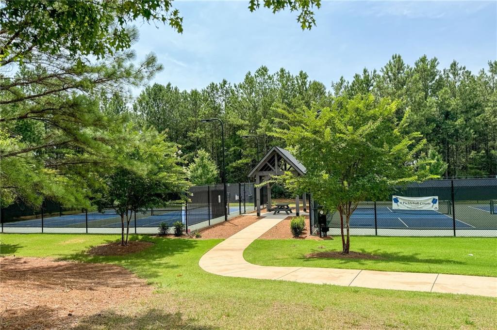 265 Fountain Oak Way Canton, GA 30114 - Photo 58 of 59 a swimming pool with lots of trees in the background