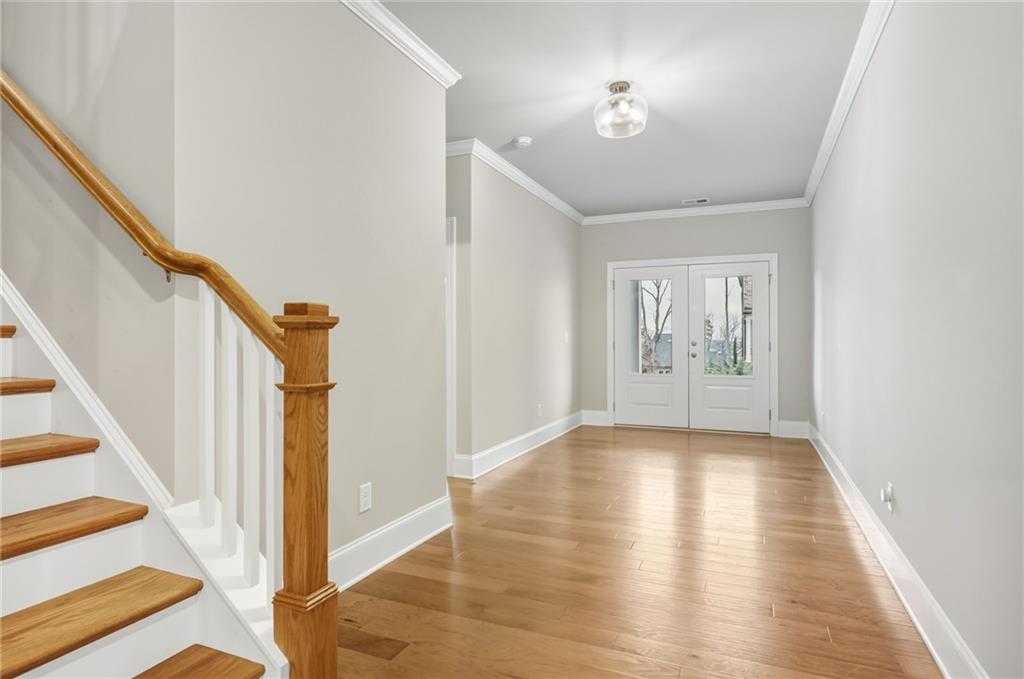265 Fountain Oak Way Canton, GA 30114 - Photo 7 of 59 a view of an entryway with wooden floor and a fireplace