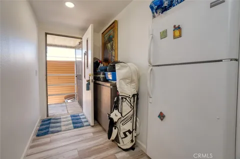 a view of a storage & utility room with two washing machine