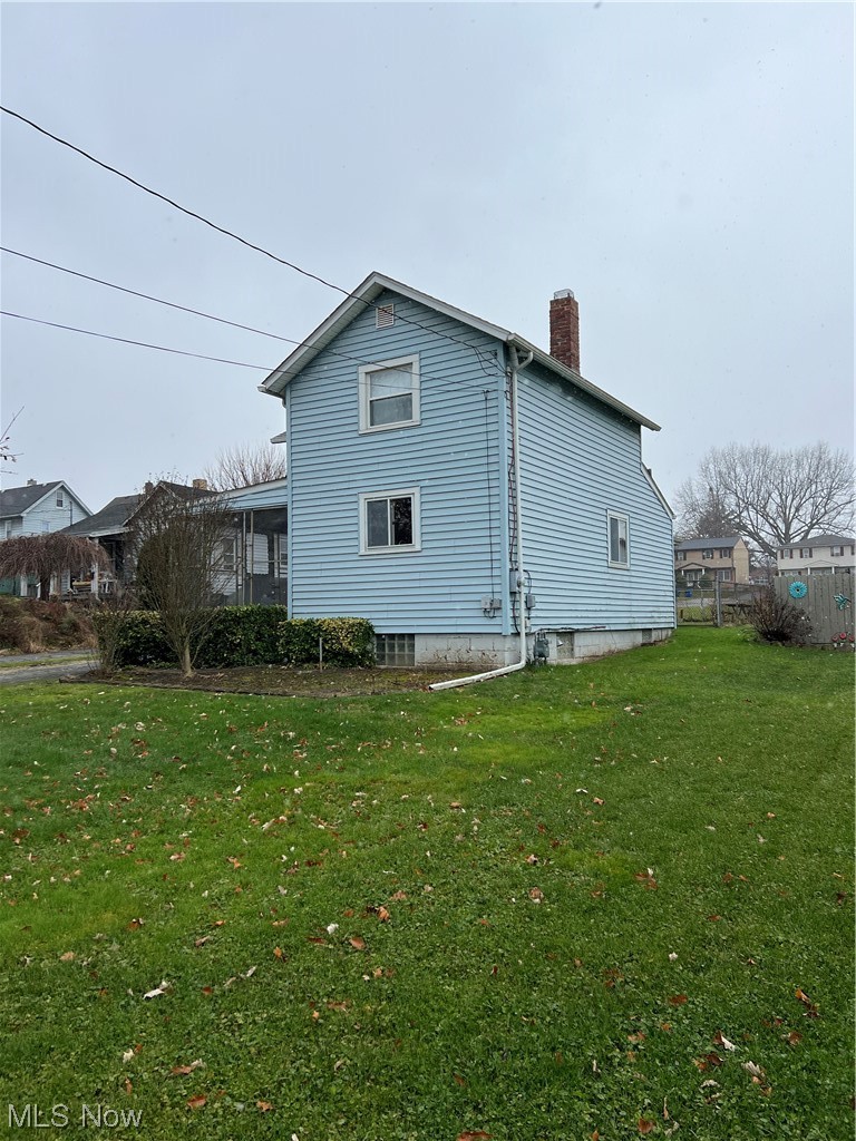 545 7th Street Struthers, OH 44471 - Photo 3 of 17 Back of house featuring a yard