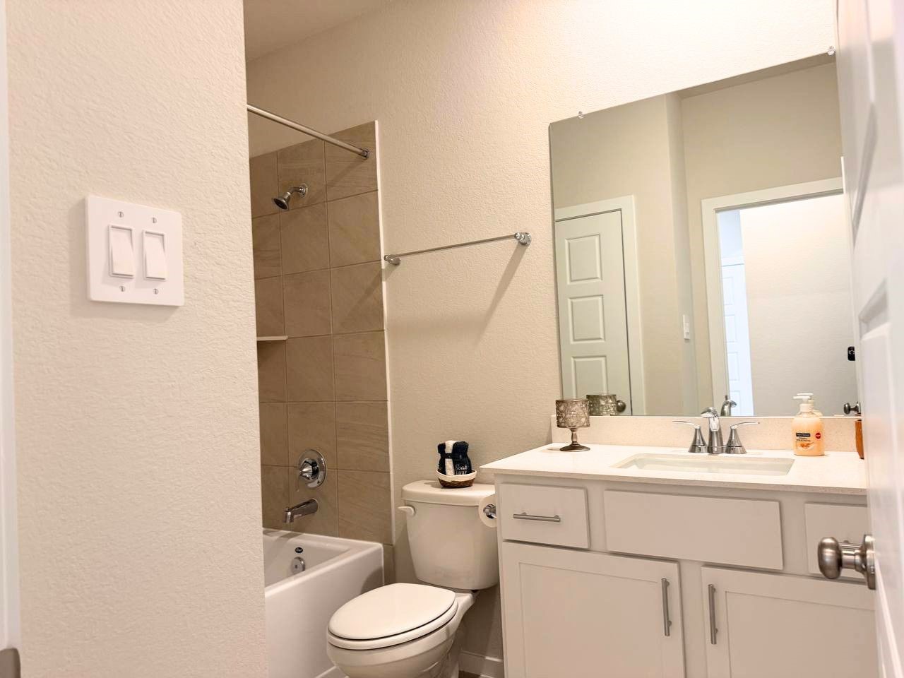 16246 Parish Pointe Court Conroe, TX 77302 - Photo 27 of 32 a bathroom with a sink a toilet and shower