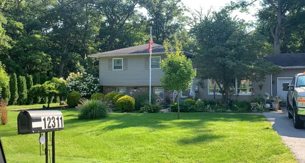 a backyard of a house with lots of green space