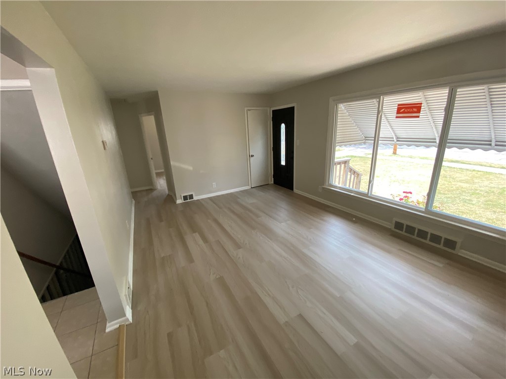 13117 Silver Road Garfield Heights, OH 44125 - Photo 9 of 20 Unfurnished living room with wood-type flooring
