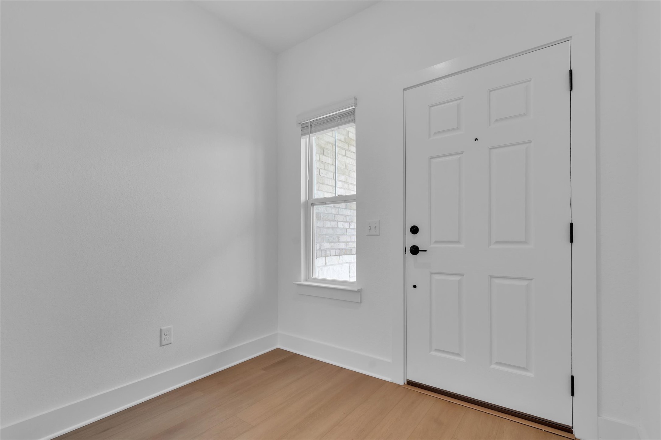 368 Bridge Deck Loop Kyle, TX 78640 - Photo 6 of 40 Entrance foyer with light wood-style flooring and baseboards