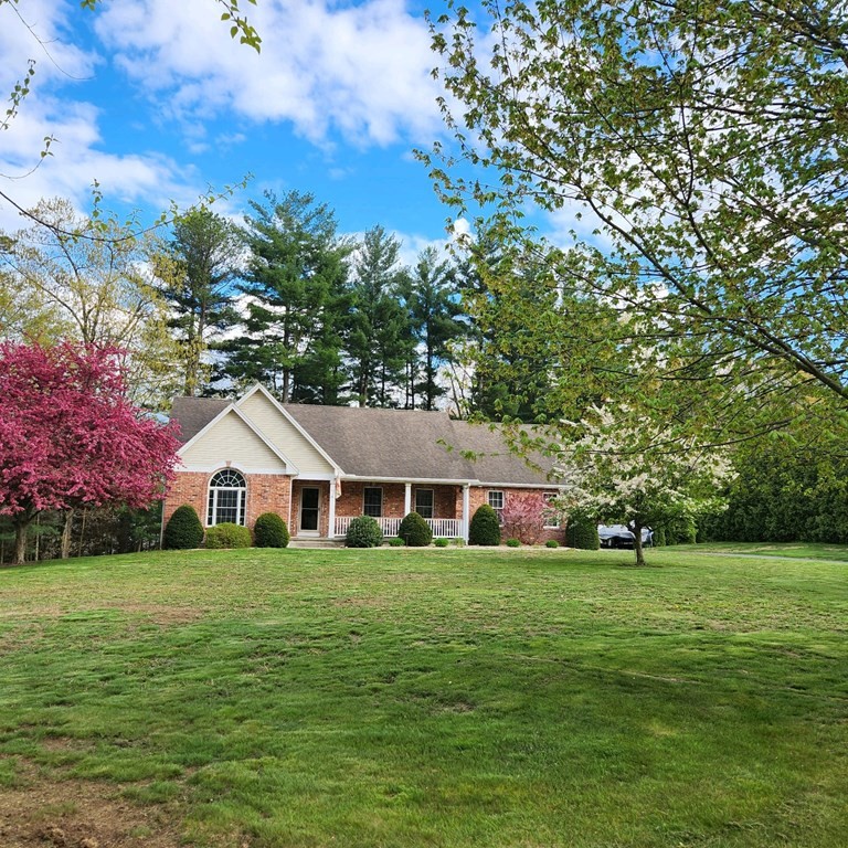 47 Lexington Circle Southwick, MA 01077 - Photo 1 of 37 a house view with a garden space