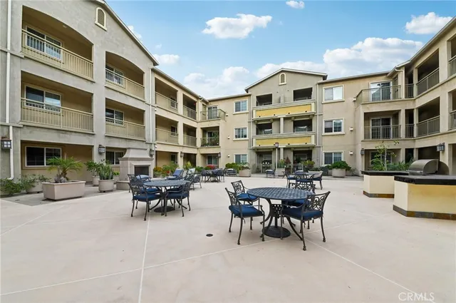 a view of a building with outdoor seating