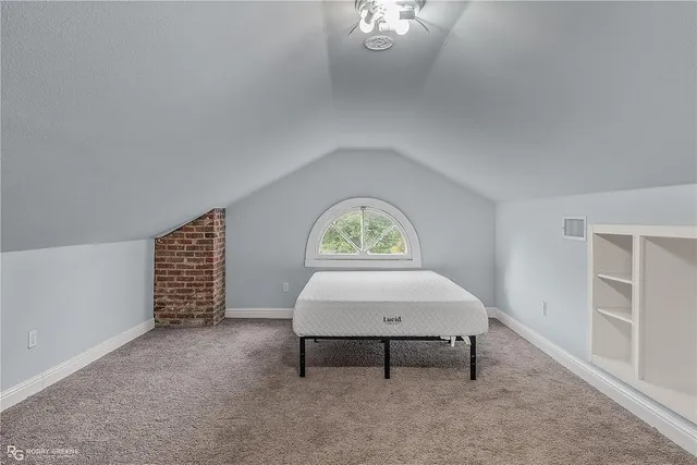 a room with pool table and a window