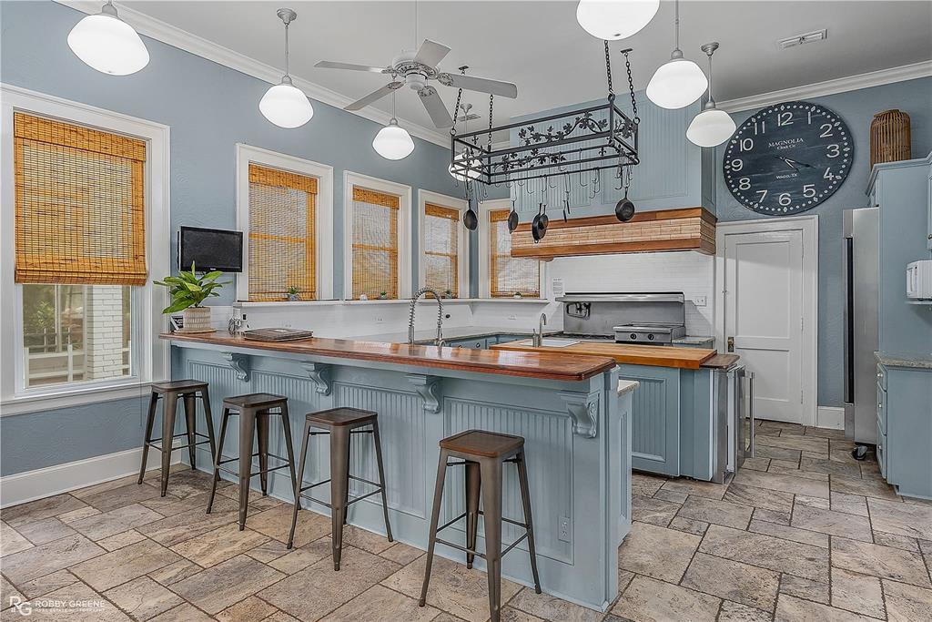 8265 Cornhusker Road Shreveport, LA 71107 - Photo 17 of 39 a kitchen with stainless steel appliances granite countertop a stove a sink and a refrigerator