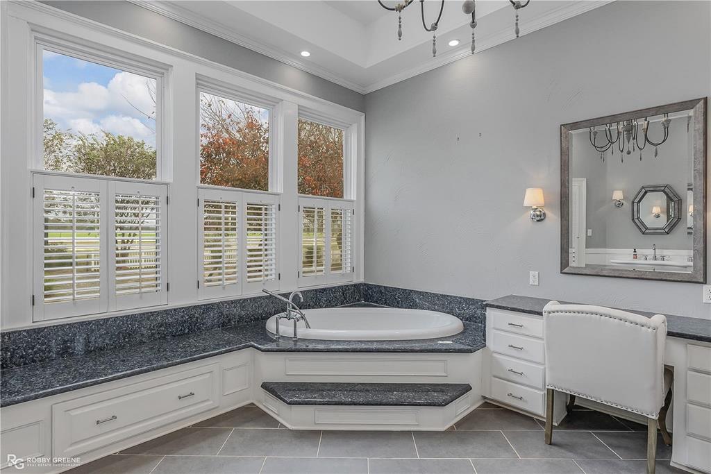 8265 Cornhusker Road Shreveport, LA 71107 - Photo 22 of 39 a bathroom with a sink and a bathtub