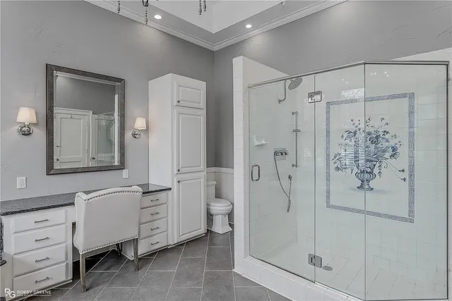 a bathroom with a shower sink and mirror