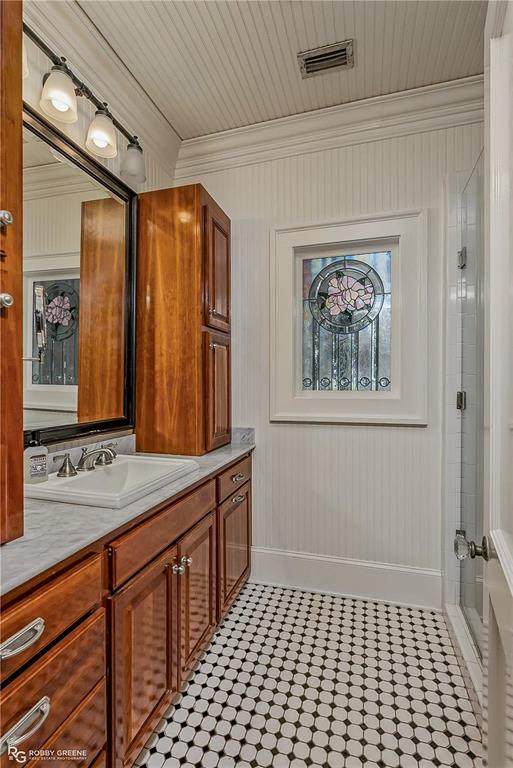 8265 Cornhusker Road Shreveport, LA 71107 - Photo 26 of 39 a bathroom with a sink a mirror and a shower