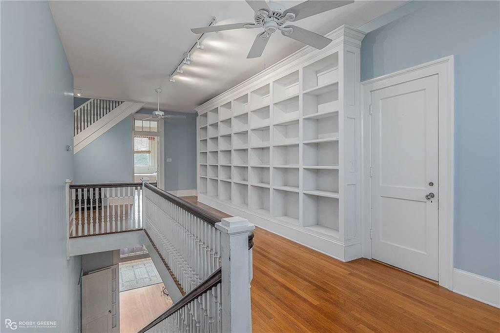 8265 Cornhusker Road Shreveport, LA 71107 - Photo 27 of 39 a view of an empty room with wooden floor and staircase
