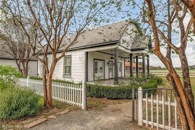 front view of a house with a garden
