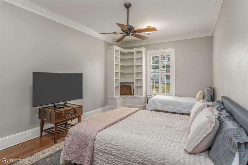 8265 Cornhusker Road Shreveport, LA 71107 - Photo 37 of 39 a bedroom with a bed and a flat screen tv
