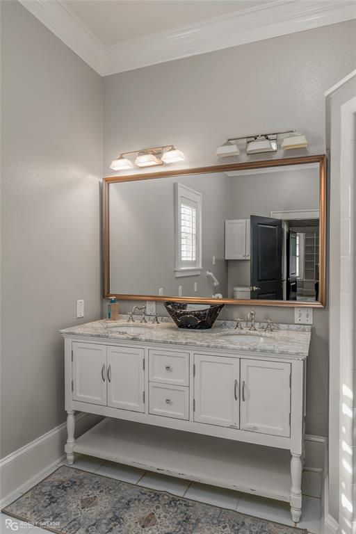 8265 Cornhusker Road Shreveport, LA 71107 - Photo 38 of 39 a bathroom with a granite countertop sink and a mirror