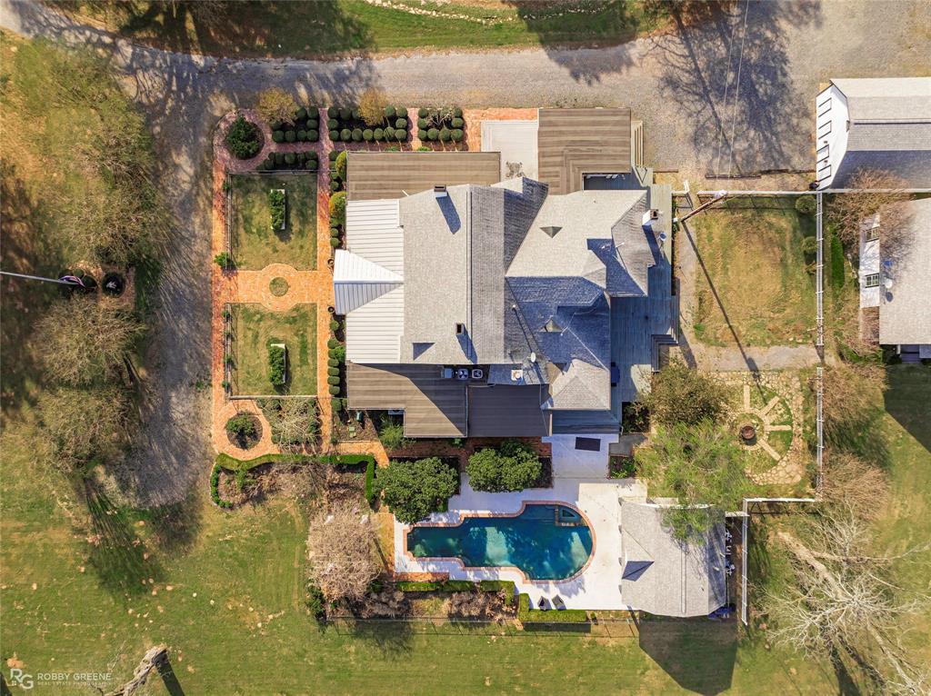 8265 Cornhusker Road Shreveport, LA 71107 - Photo 4 of 39 a aerial view of a house with swimming pool and outdoor seating