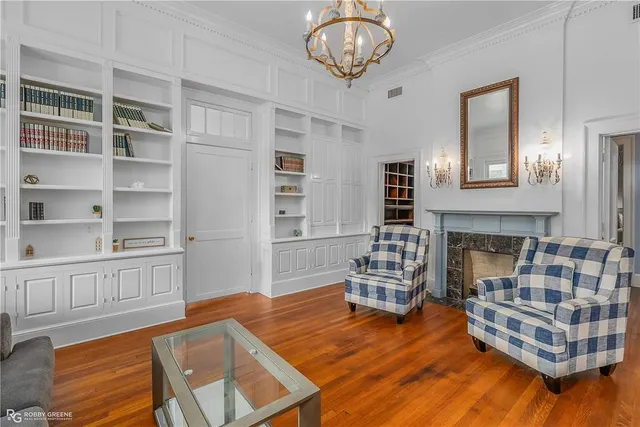 a bedroom with furniture and a window