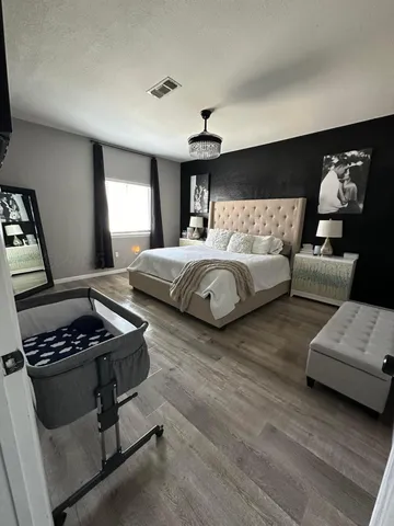 a bedroom with furniture and window