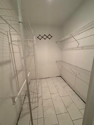 a living room with furniture wooden floor and a fireplace