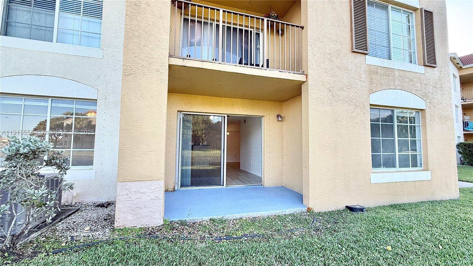 4190 San Marino Boulevard, Unit 102 West Palm Beach, FL 33409 - Photo 11 of 33 front view of a house with a yard