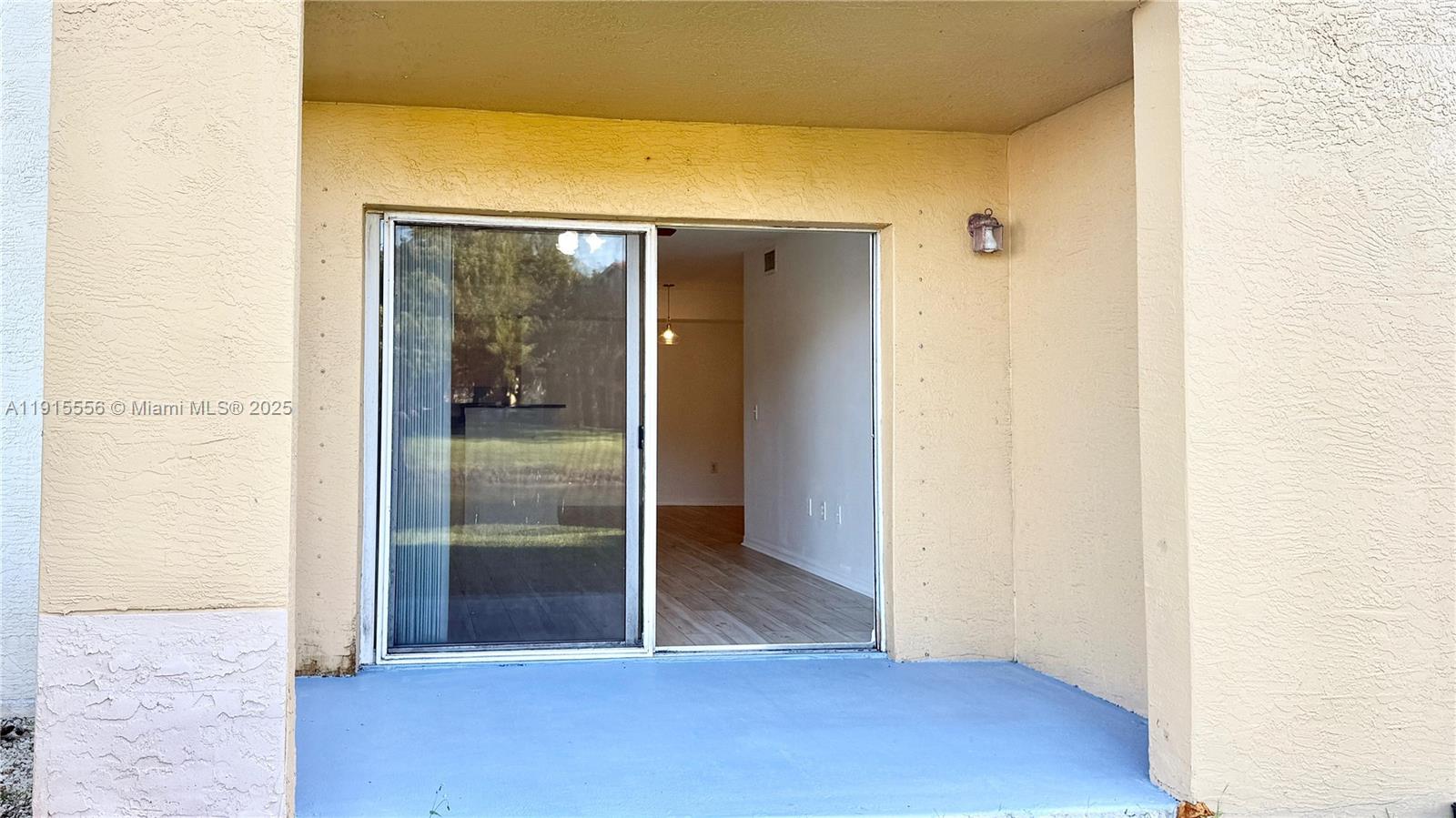 4190 San Marino Boulevard, Unit 102 West Palm Beach, FL 33409 - Photo 12 of 33 a view of a hallway with wooden floor