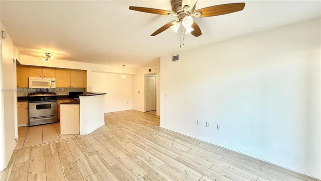 a view of a kitchen from the hallway