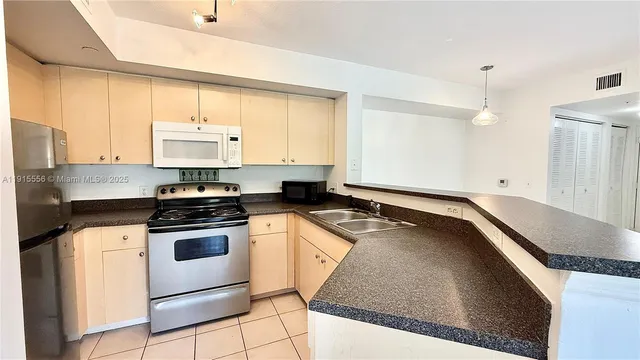 a view of a room with wooden floor and windows