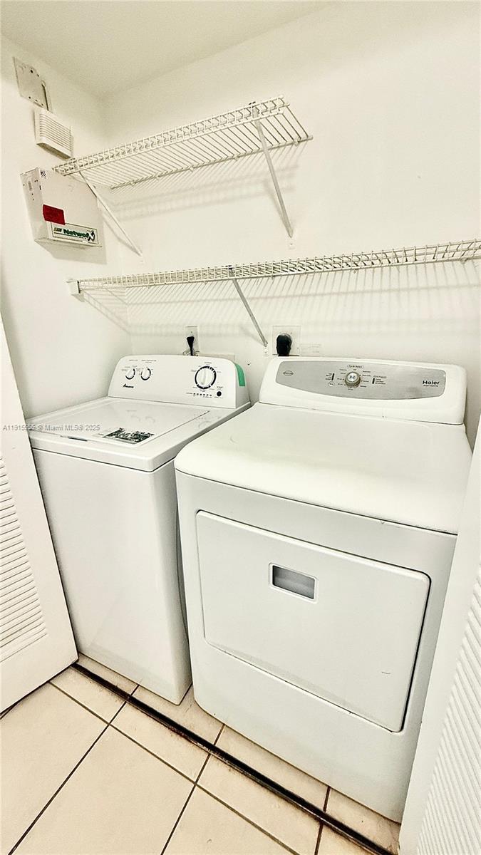 4190 San Marino Boulevard, Unit 102 West Palm Beach, FL 33409 - Photo 33 of 33 a utility room with dryer and washer