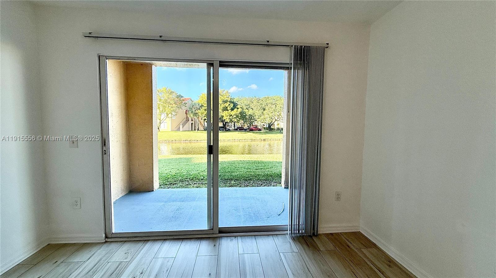 4190 San Marino Boulevard, Unit 102 West Palm Beach, FL 33409 - Photo 4 of 33 a view of front door and wooden floor