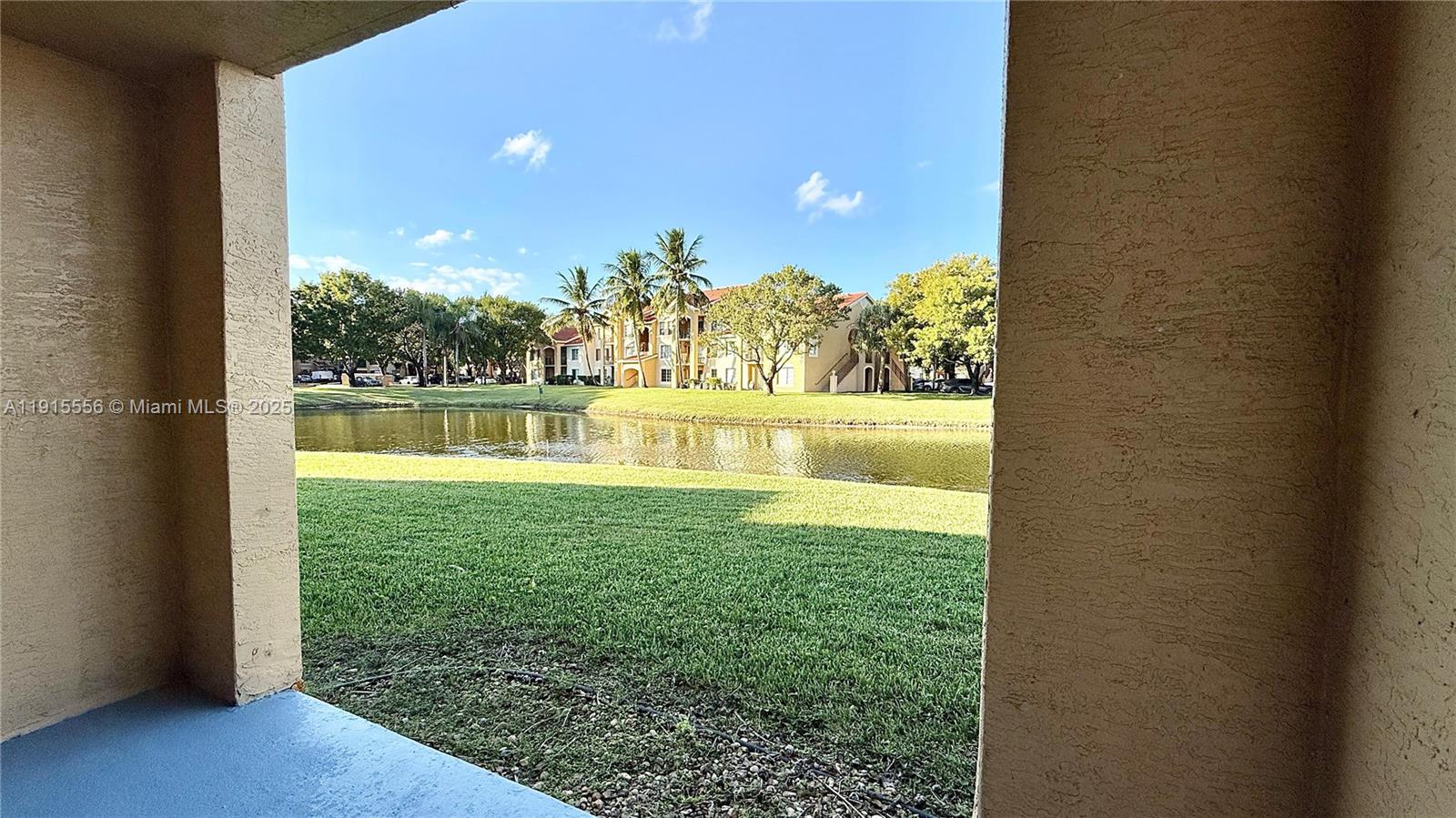 4190 San Marino Boulevard, Unit 102 West Palm Beach, FL 33409 - Photo 5 of 33 a view of yard from a window