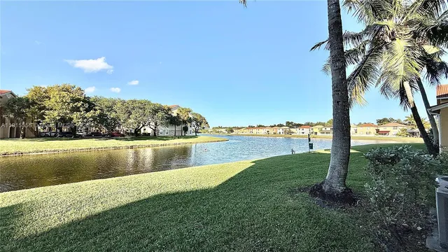 a view of a lake with a yard