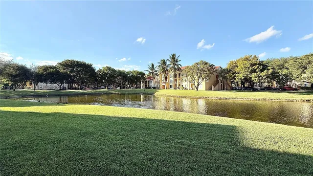 a view of a swimming pool with an outdoor space and seating area