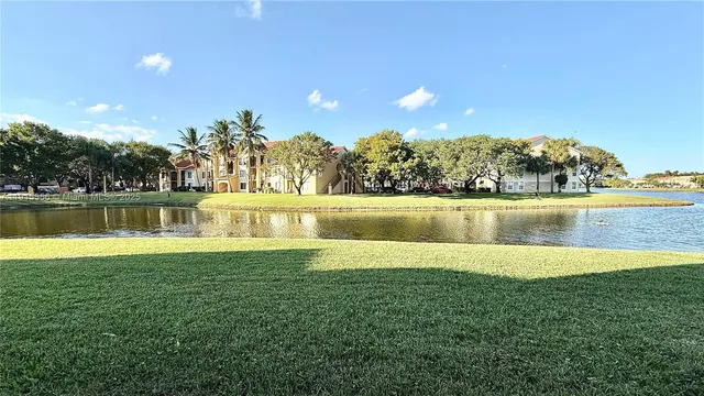 a view of a lake with a big yard