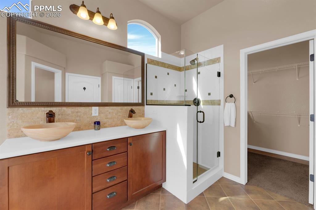 7636 Wichita Ridge Point Colorado Springs, CO 80923 - Photo 16 of 33 Primary bathroom w/ walk-in closet