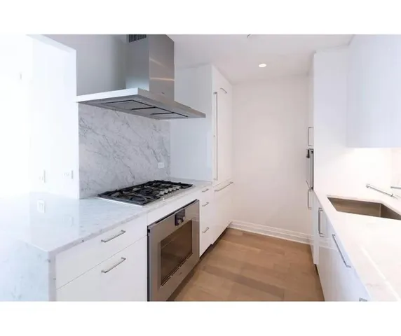 a kitchen with a stove and a sink