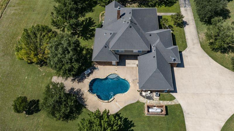 334 Farm To Market Road 2264 Decatur, TX 76234 - Photo 3 of 40 an aerial view of a house with outdoor space and lake view