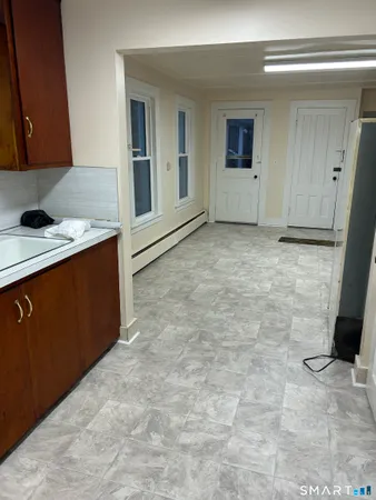 a room with a sink and cabinets