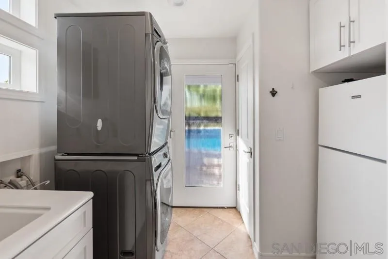 12750 McFeron Road Poway, CA 92064 - Photo 28 of 51 a white refrigerator freezer and a stove sitting inside of a kitchen