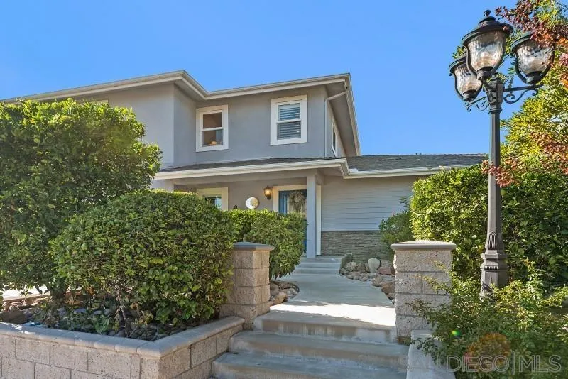 12750 McFeron Road Poway, CA 92064 - Photo 3 of 51 a front view of a house with garden