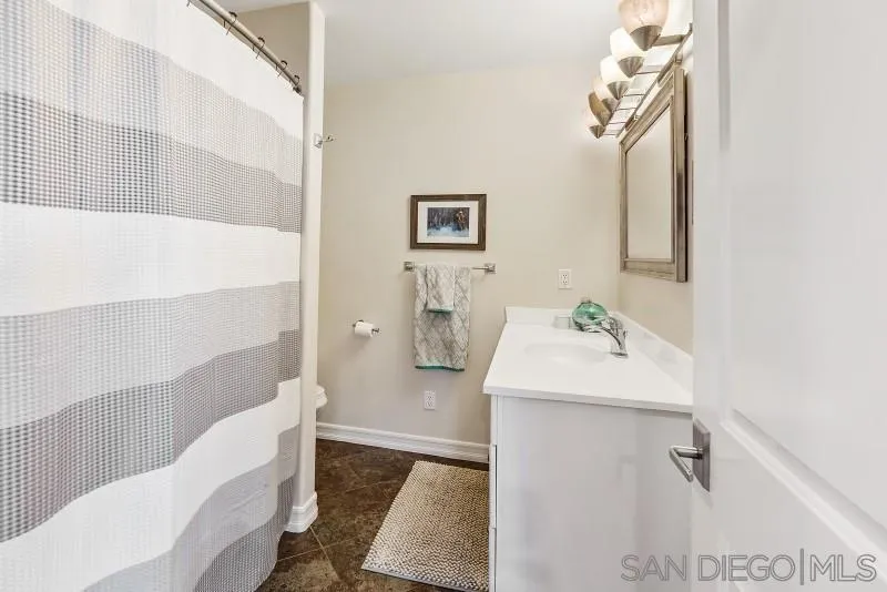 12750 McFeron Road Poway, CA 92064 - Photo 31 of 51 a bathroom with a sink toilet and shower
