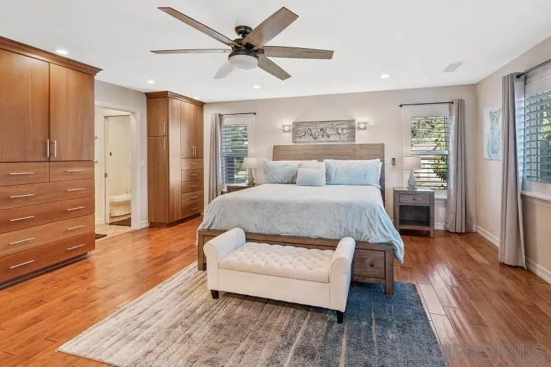 12750 McFeron Road Poway, CA 92064 - Photo 7 of 51 a bedroom with a bed and wooden floor