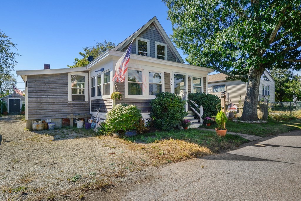20 13th Street Wareham, MA 02558 - Photo 2 of 30 a front view of a house with a yard