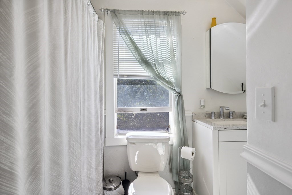 20 13th Street Wareham, MA 02558 - Photo 21 of 30 a bathroom with a toilet a sink and a window