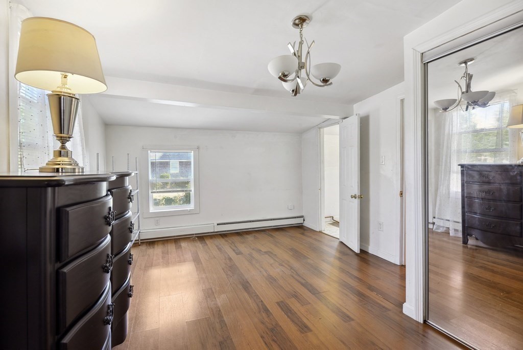 20 13th Street Wareham, MA 02558 - Photo 23 of 30 a view of a room with wooden floor cabinet and a chandelier