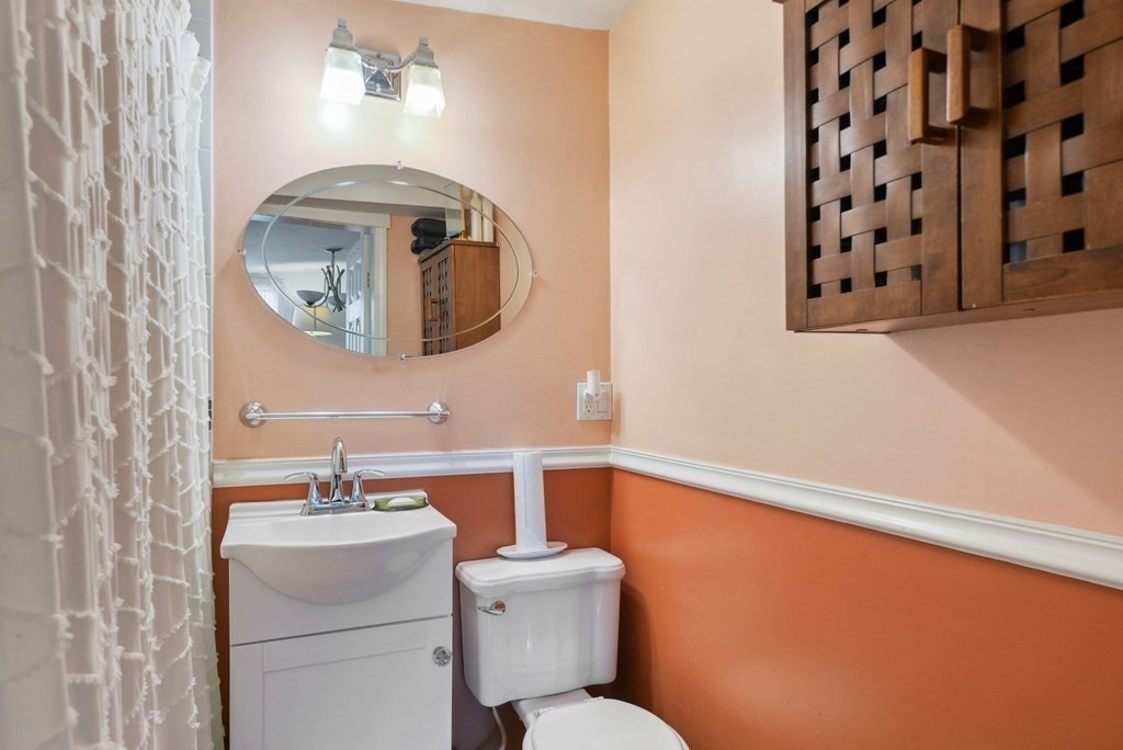 20 13th Street Wareham, MA 02558 - Photo 26 of 30 a bathroom with a toilet sink and mirror