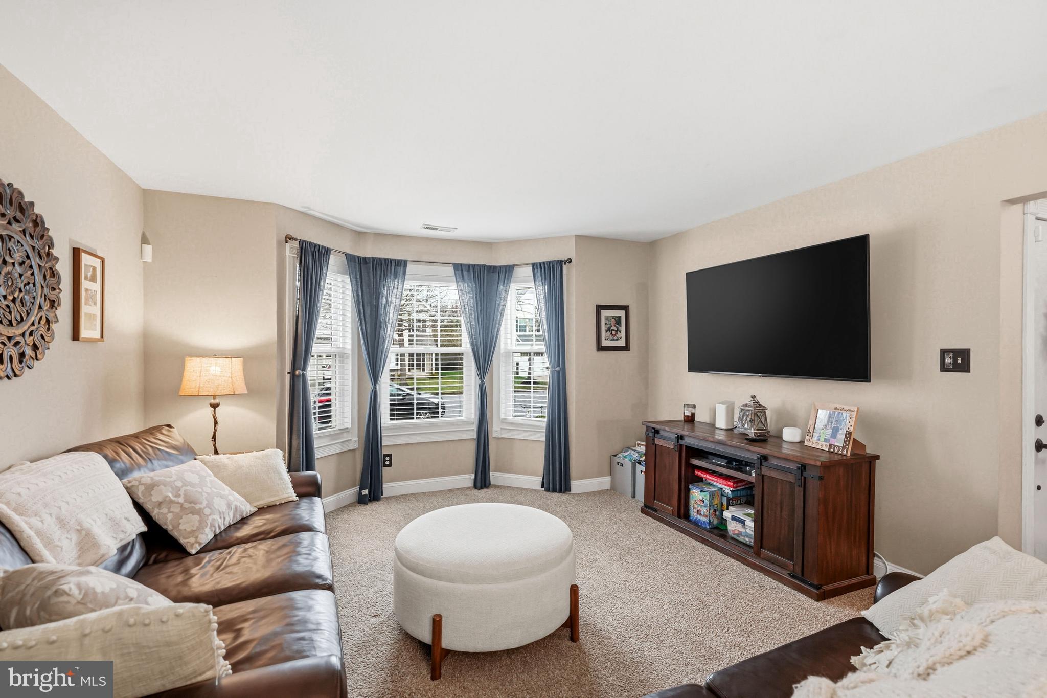 7 Watson Drive Mount Laurel, NJ 08054 - Photo 10 of 42 a living room with furniture and a flat screen tv