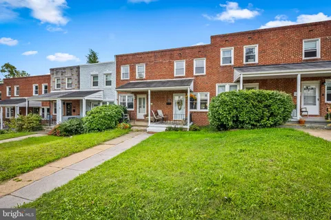 a front view of a house with garden and porch