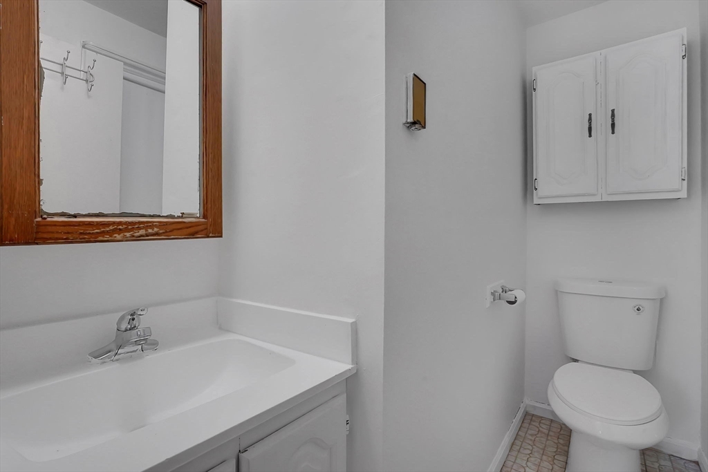 290 Newton Road Springfield, MA 01118 - Photo 21 of 38 a bathroom with a sink toilet and vanity