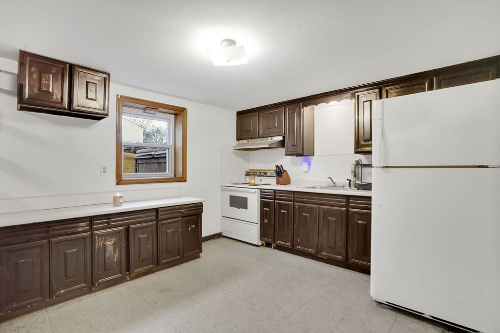 290 Newton Road Springfield, MA 01118 - Photo 22 of 38 a kitchen with stainless steel appliances granite countertop a refrigerator and a sink
