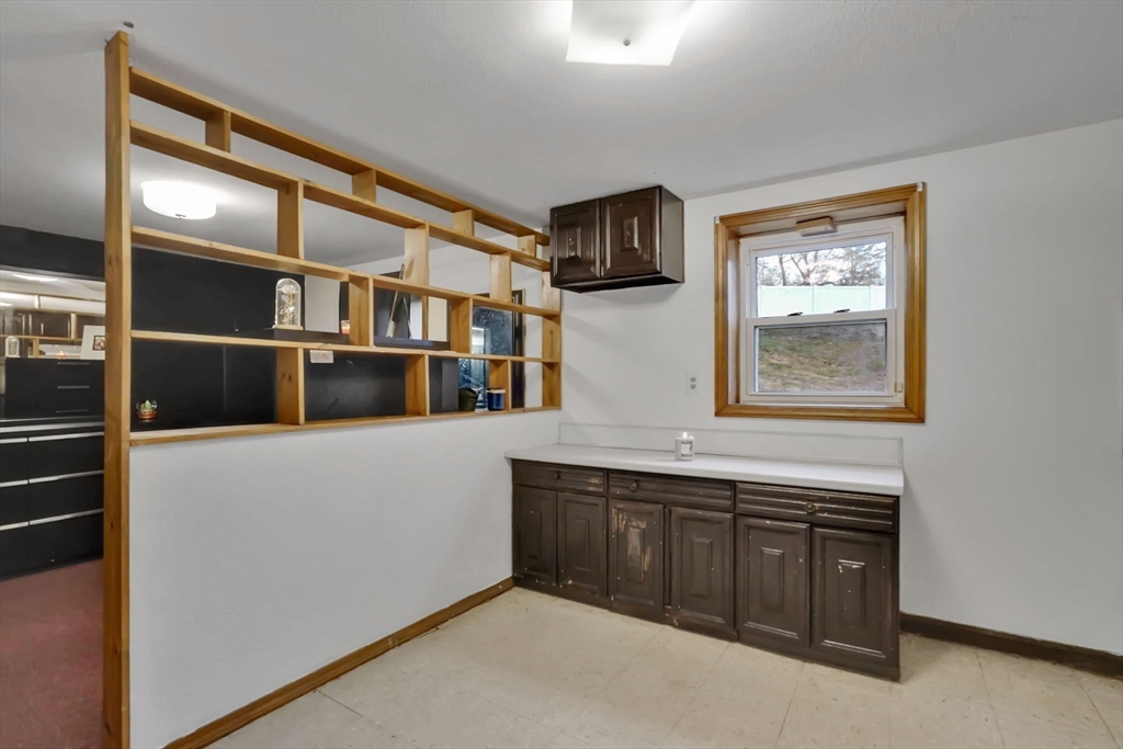 290 Newton Road Springfield, MA 01118 - Photo 24 of 38 a hallway with cabinets a sink and a window